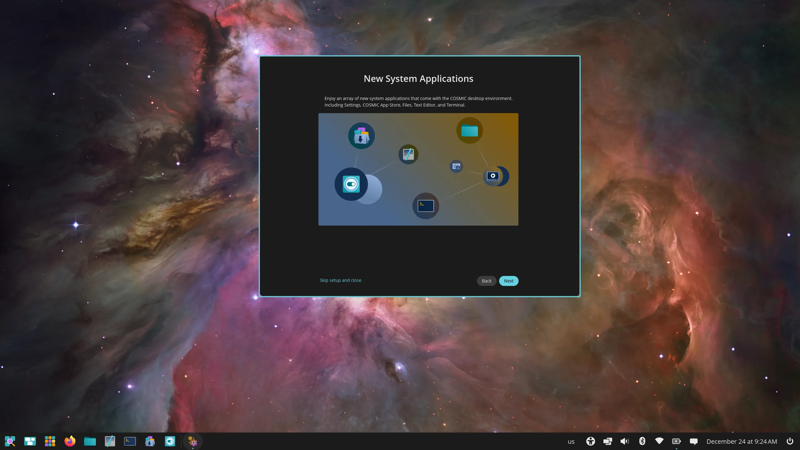 “New System Applications” during initial setup window with icons for the applications highlighted in an image and text that says, “Enjoy an array of new system applications that come with the COSMIC desktop environment. Including Settings, COSMIC App Store, Files, Text Editor, and Terminal.”