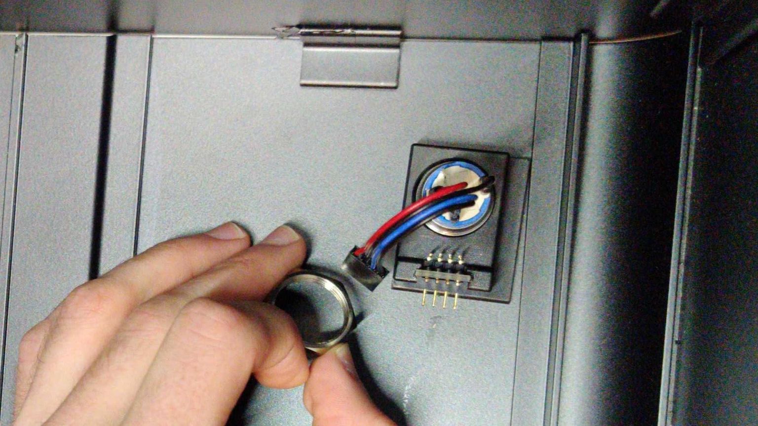 Screwing in the power button