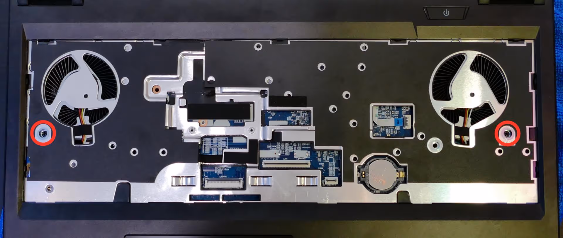 Under-keyboard screws