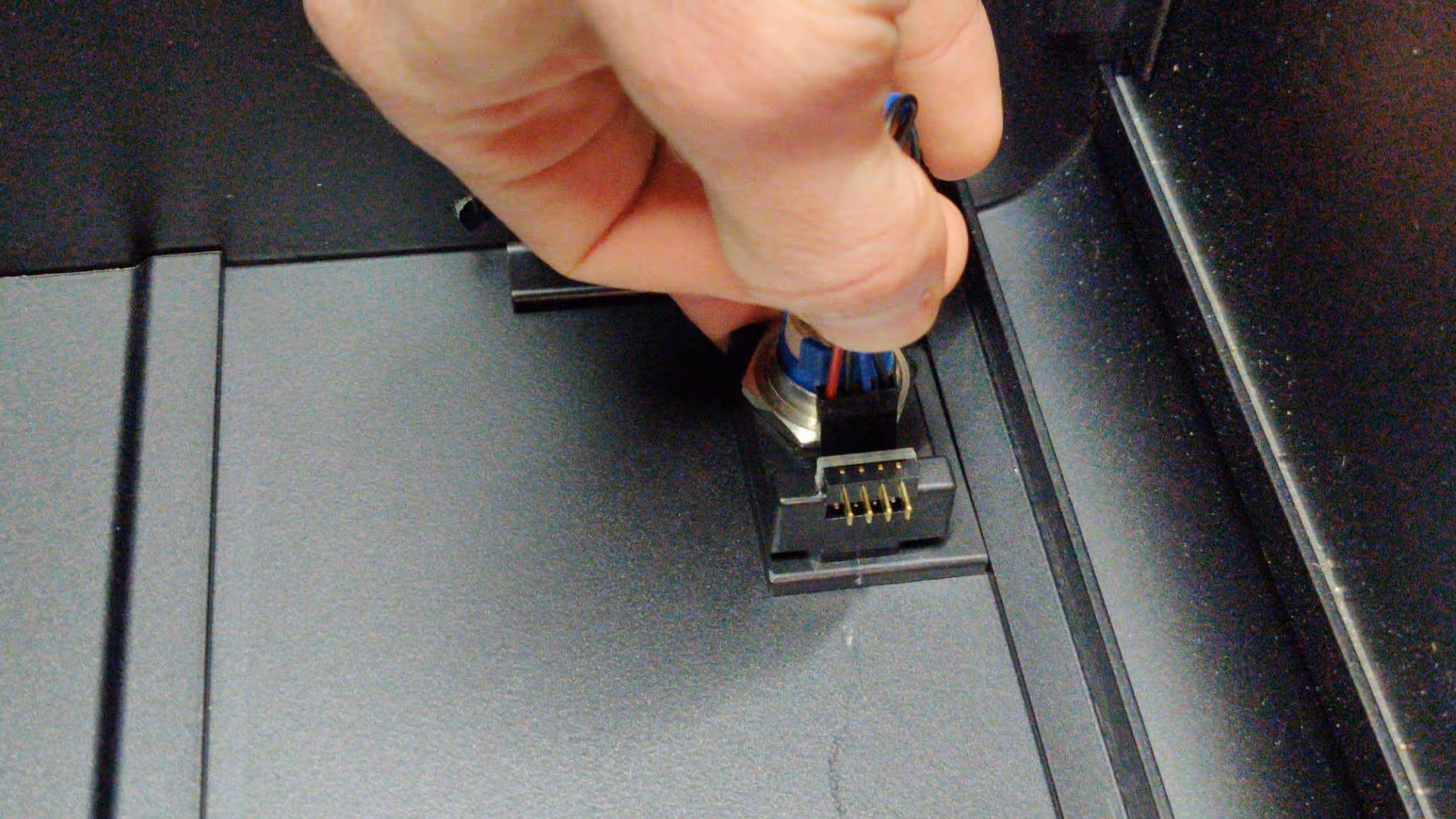 Unplugging power button from 90-degree connector
