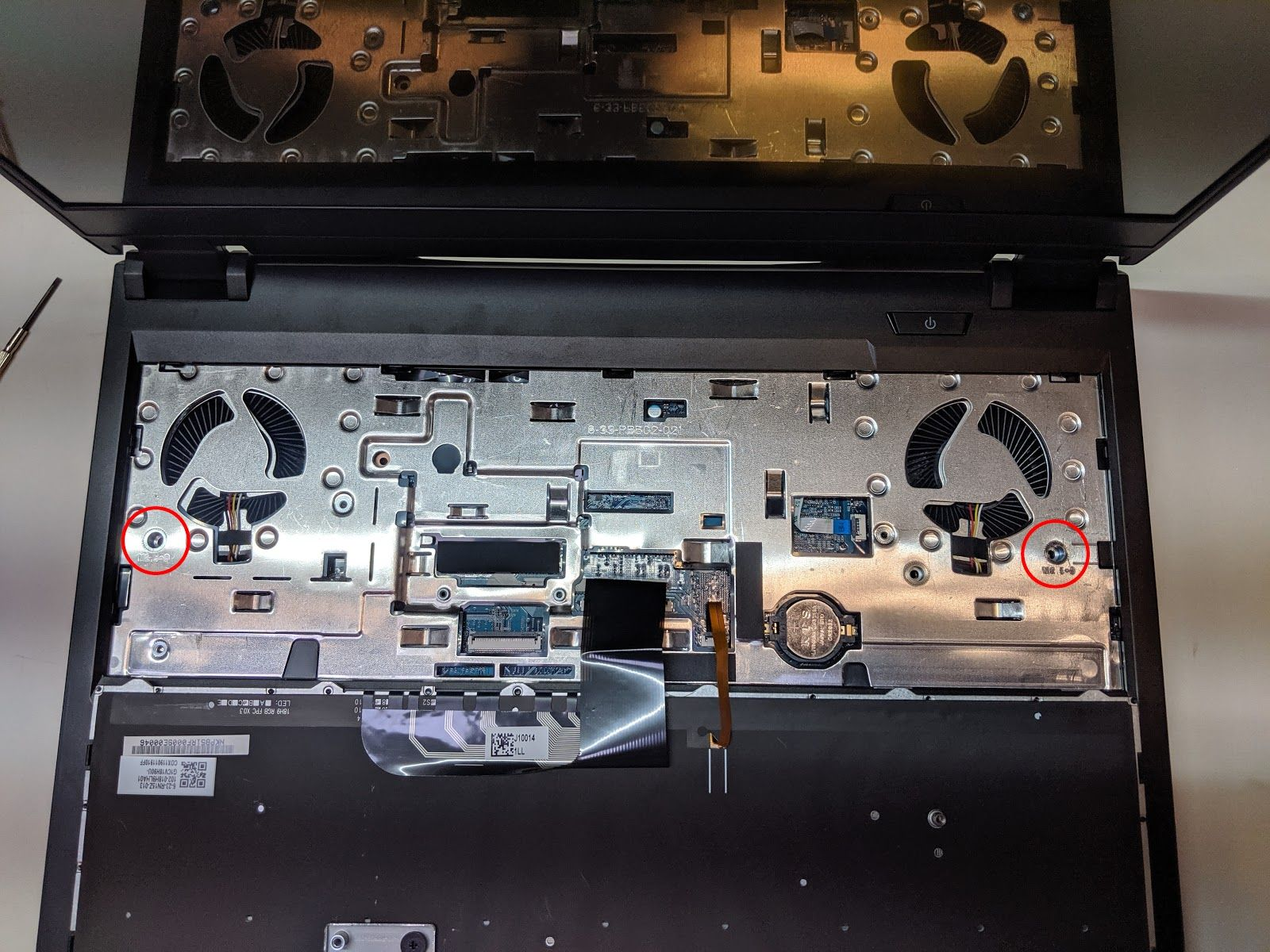 Under-keyboard screws