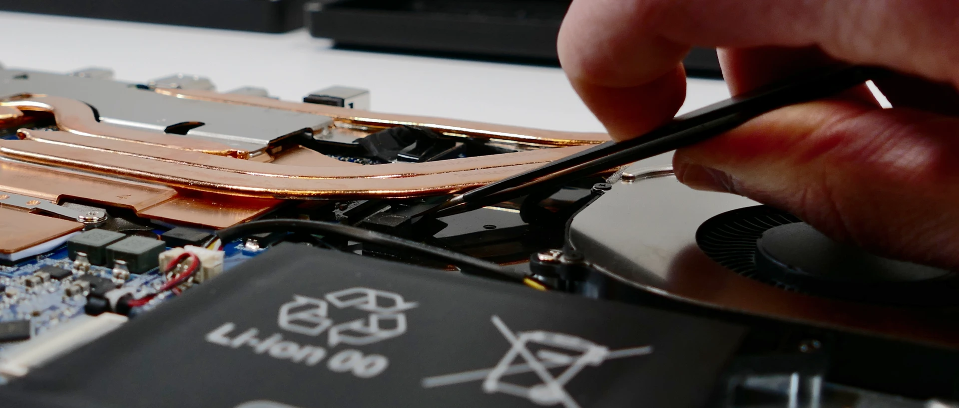 Keyboard adhesive strip removal