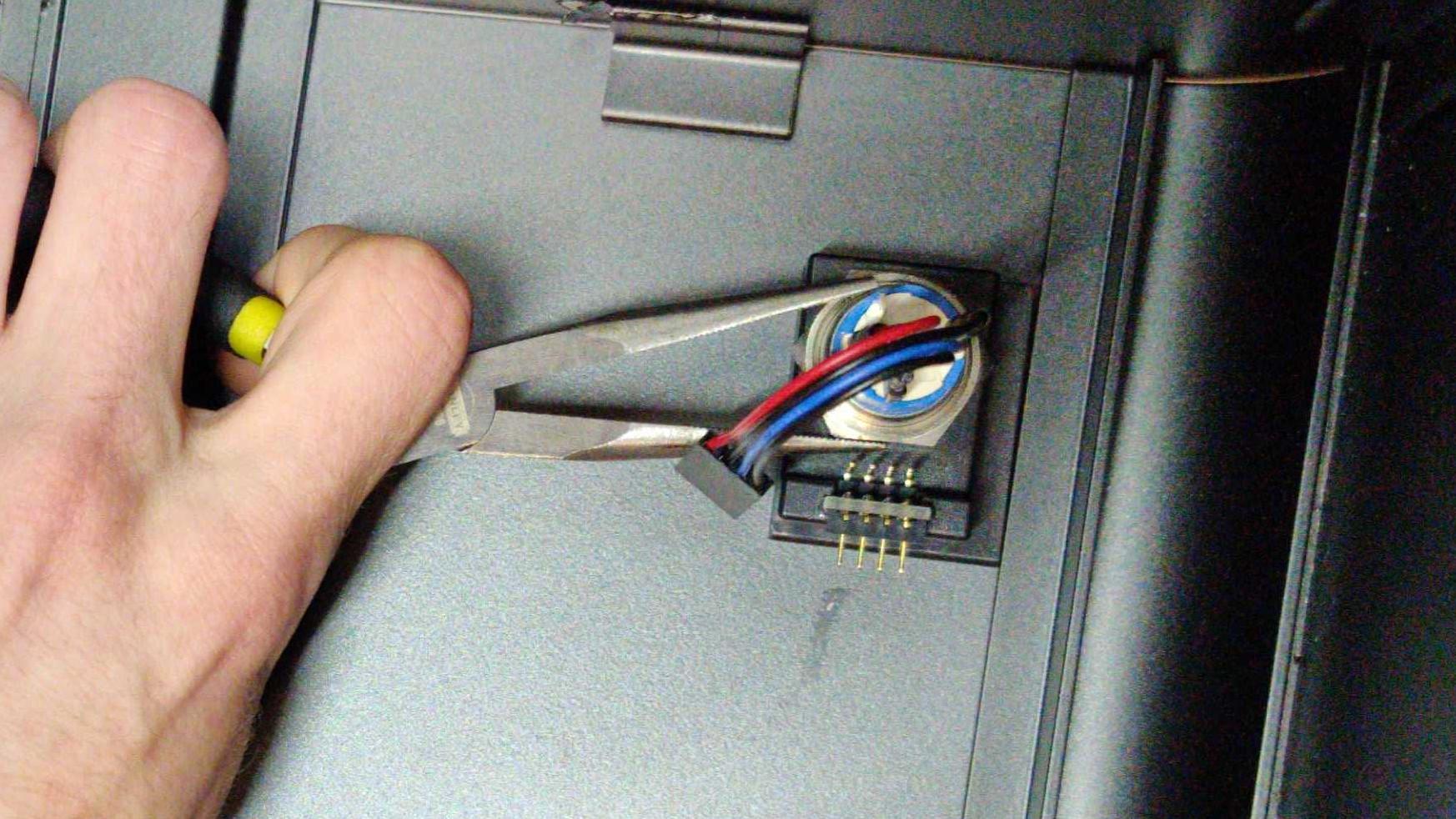 Needle-nose pliers can help with unscrewing the nut